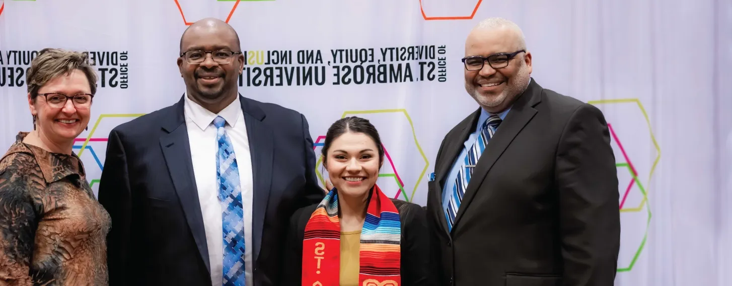 A group posing at a Diversity, Equity, and Inclusion event.